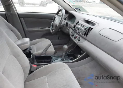 2002 Toyota Camry Le z USA, uszkodzony, nr VIN JTDBE32K720119418